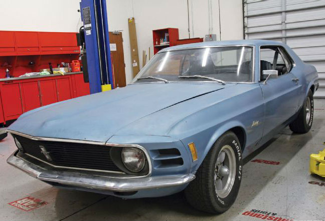 mdmp_1104_03_o+1970_ford_mustang_project_high_school_hauler+driver_side_front