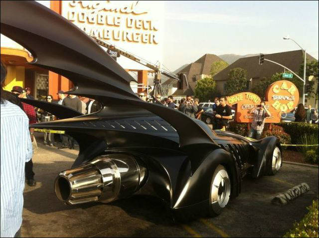five generations of batmobile on the road 5