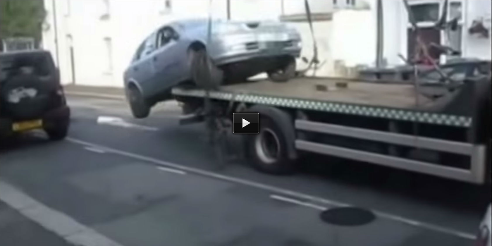 Avoid Parking Ticket tow truck unloading in reverse
