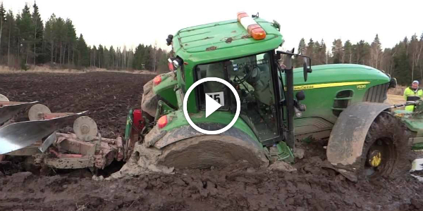 Towing a JOHN DEERE 2 045 That is Stuck In The MUD! But We Have A Successful Savior! Guess WHO!! JOHN DEERE 2045