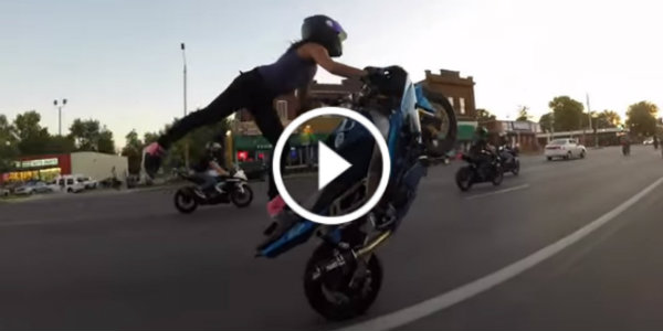 girl biker wheelies on the street 32