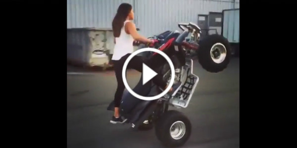 Young Woman Doing Quad Bike Stunts 1 play