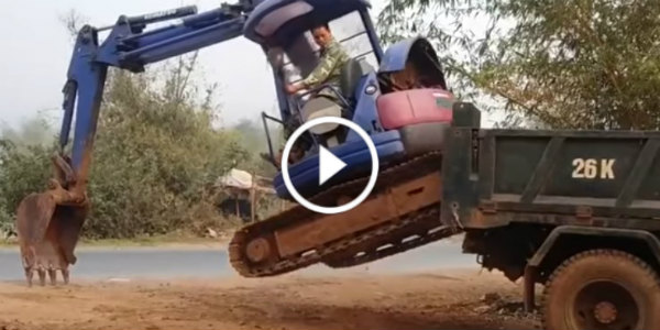 Excavator Driver Loads Onto A Truck Skills 11