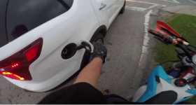 Biker Pulled Over Steps On Grass driver police gas tap 2