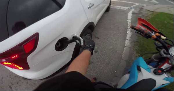 Biker Pulled Over Steps On Grass driver police gas tap 2