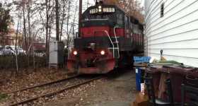 Huge Freight Train Gets Inside a Backyard 1
