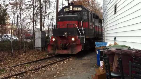 Huge Freight Train Gets Inside a Backyard 1