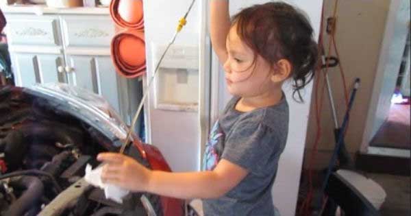 Little Girl Mechanic Changes Oil 1